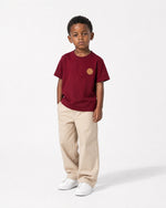 Romimi Signature Crest Tee in burgundy, worn by a boy, full-length view
