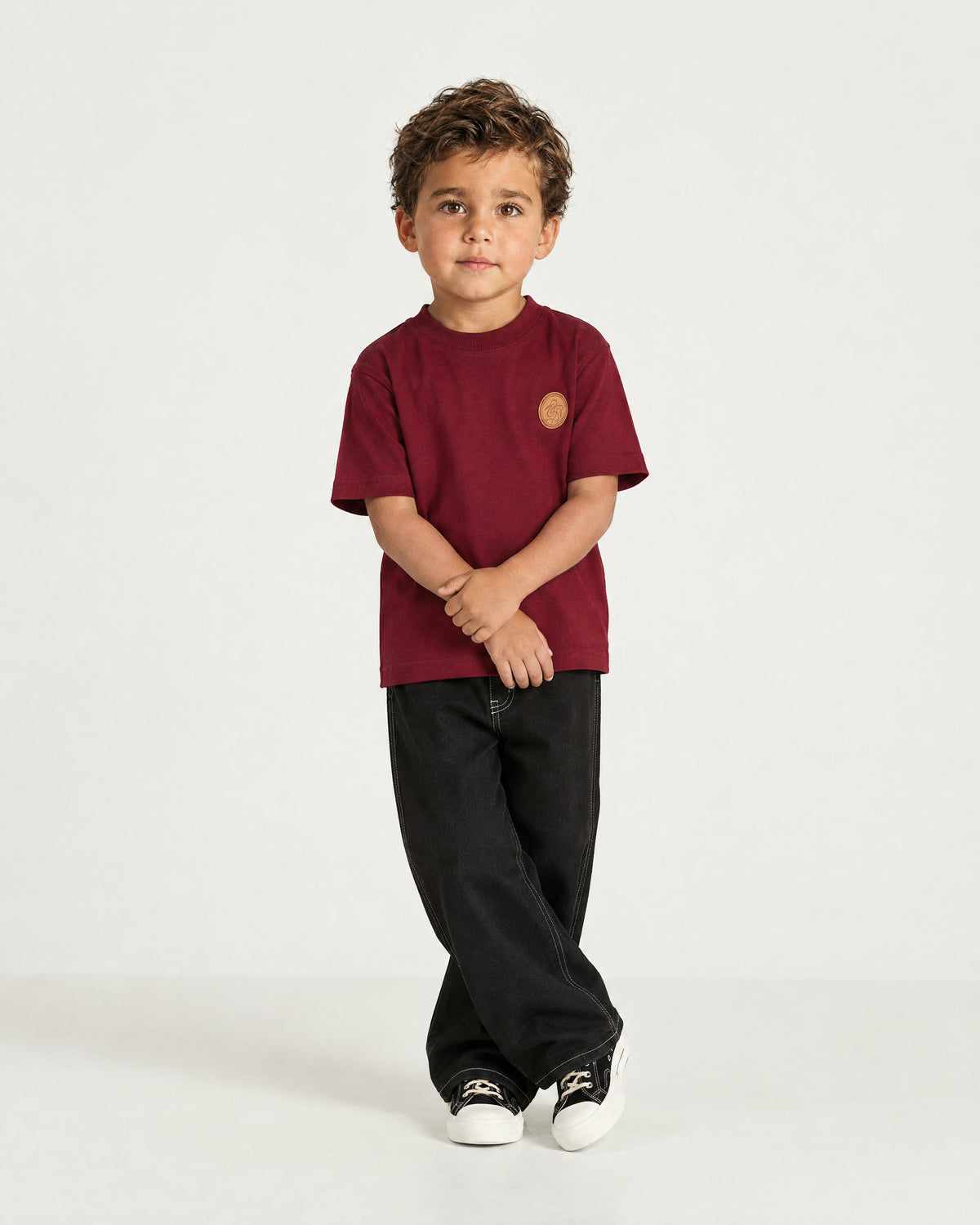 Little boy wearing the Romimi Signature Crest Tee, full length