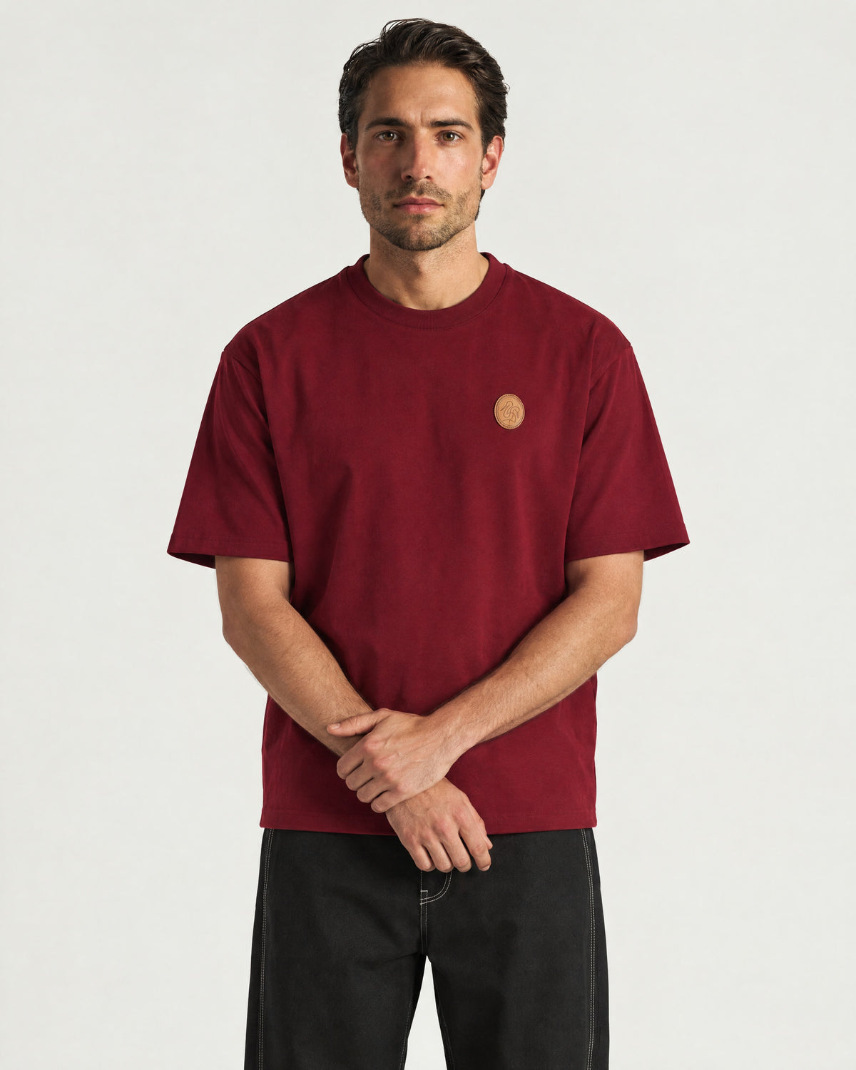 Man wearing the Romimi Signature Crest Tee, front view