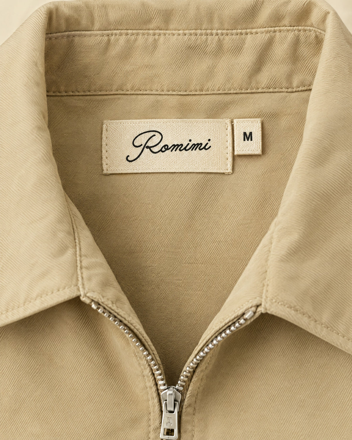 Romimi Slim Tech Suit in Beige, label close-up
