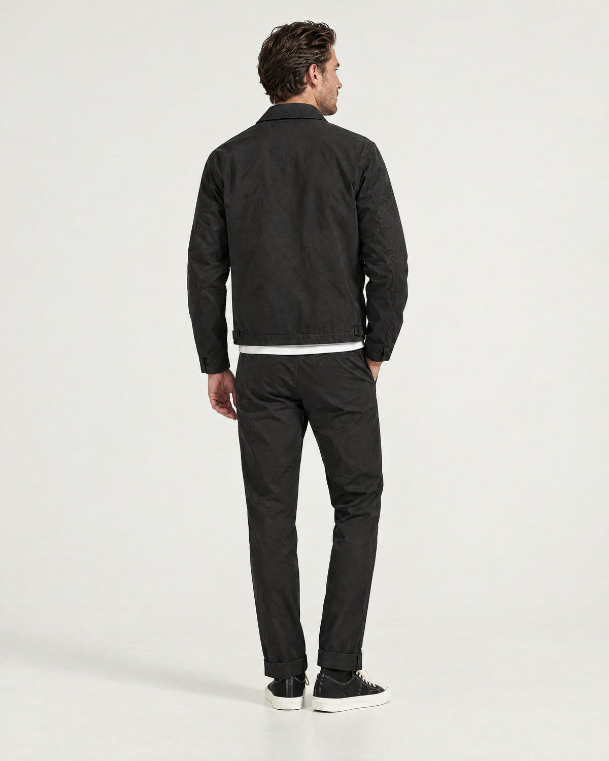 Romimi Slim Tech Suit in Black, back view, worn