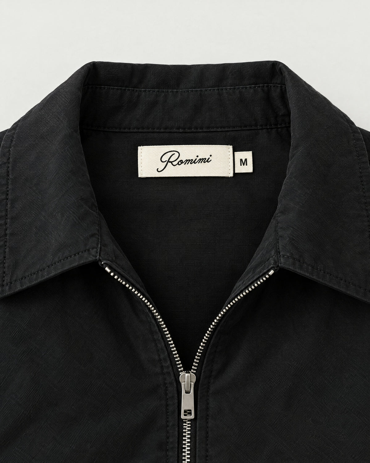 Romimi Slim Tech Suit in Black, label close-up