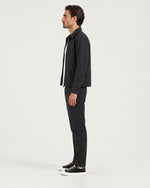 Romimi Slim Tech Suit in Black, side view, worn