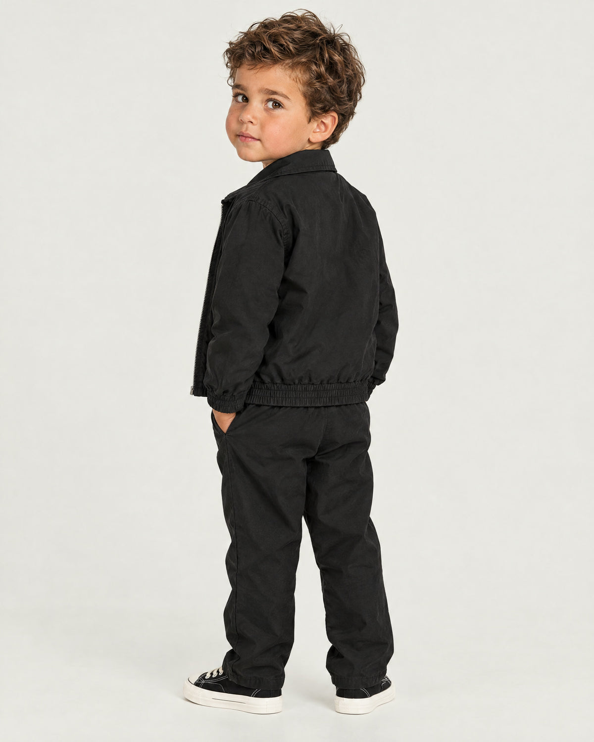 Romimi Tech Tracksuit for kids in Black, back view, worn