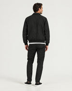 Romimi Tech Tracksuit in Black, back view, worn