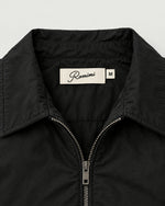 Romimi Tech Tracksuit in Black, label close-up