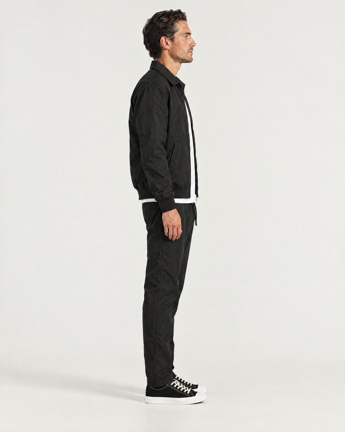 Romimi Tech Tracksuit in Black, side view, worn