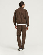 Romimi Tech Tracksuit in Brown, back view, worn