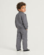 Romimi Tech Tracksuit for kids in Charcoal, back view, worn