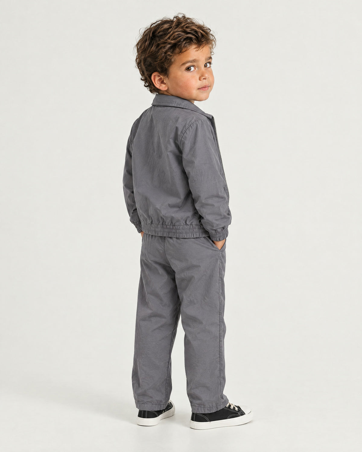 Romimi Tech Tracksuit for kids in Charcoal, back view, worn