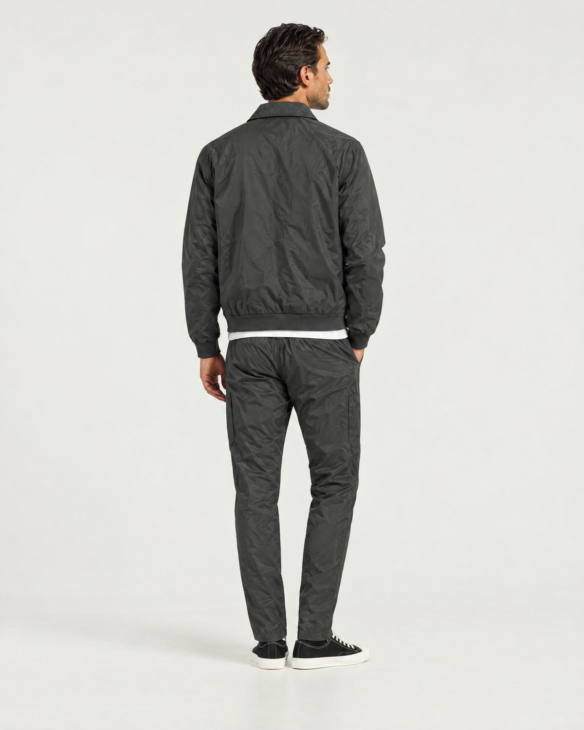 Romimi Tech Tracksuit in Charcoal, back view, worn