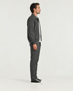 Romimi Tech Tracksuit in Charcoal, side view, worn