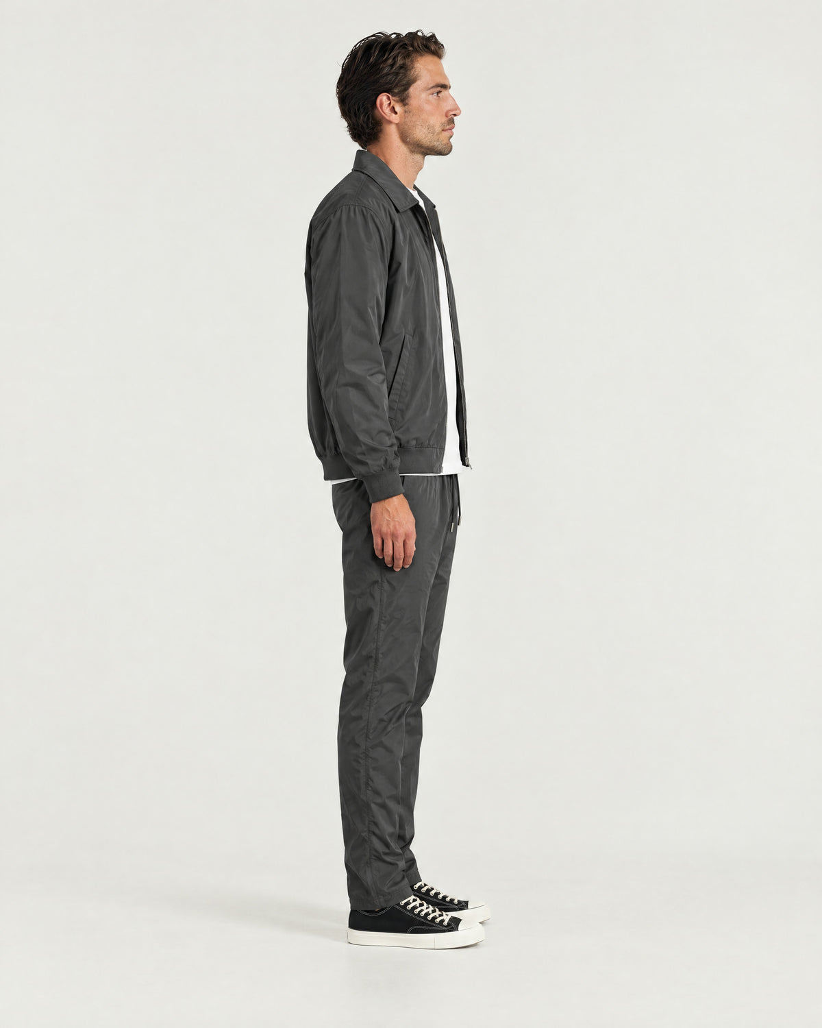 Romimi Tech Tracksuit in Charcoal, side view, worn