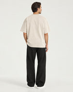 Romimi Washed Heavy Tee in Apricot, back view, worn