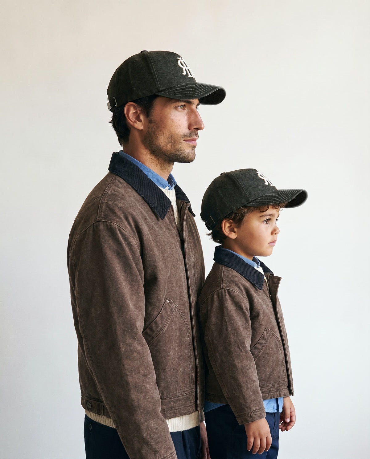 Father and son wearing the Romimi wool baseball cap in dark olive