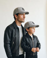 Father and son wearing the Romimi wool baseball cap in heather grey