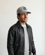 Man wearing the wool baseball cap in heather grey